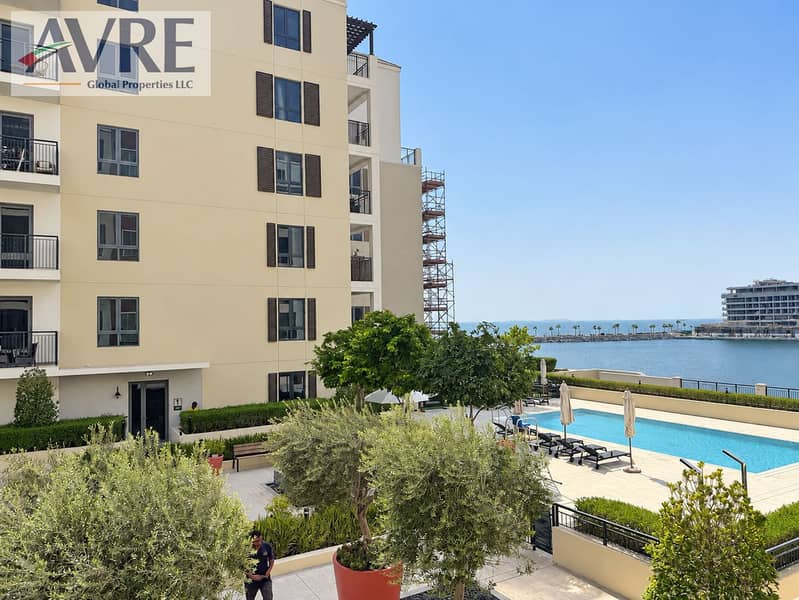 5 Sunny Waterfront Apartment Poolscape. png