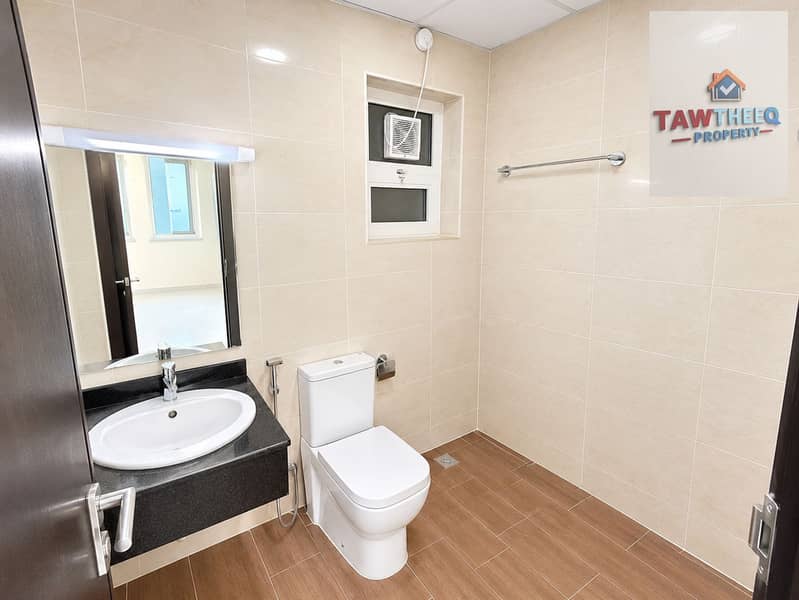 10 Bright Modern Beige-Tiled Bathroom. png