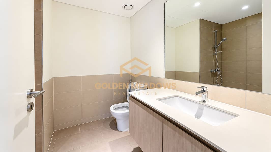10 Bright Minimalist Beige-Tiled Bathroom. png