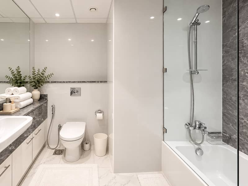 17 Refined grey marble hotel bathroom. png