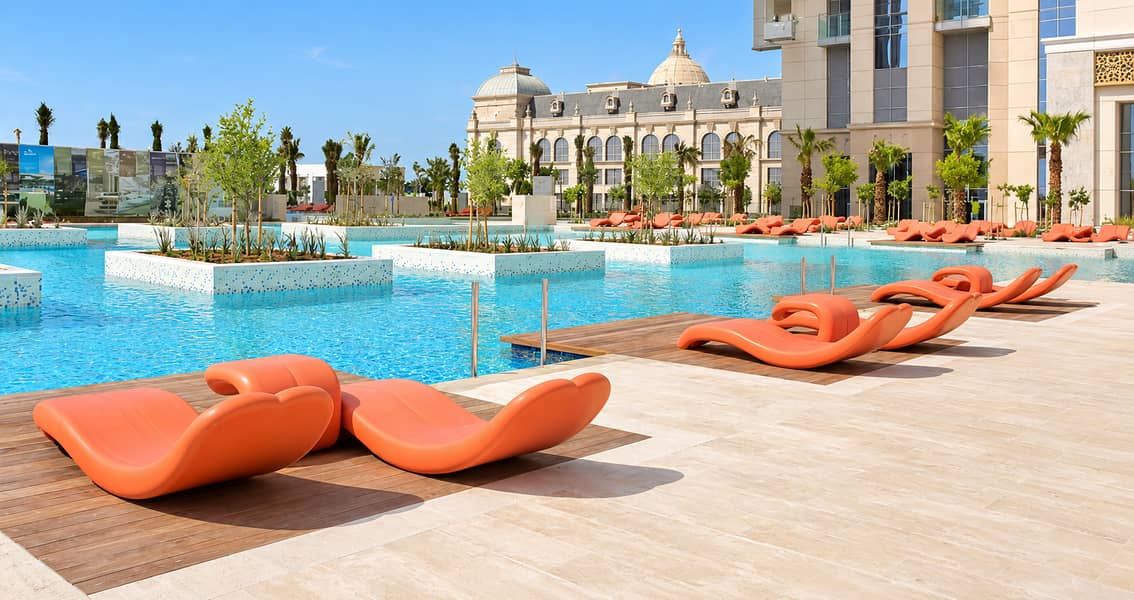 23 Azure pool with orange loungers. png