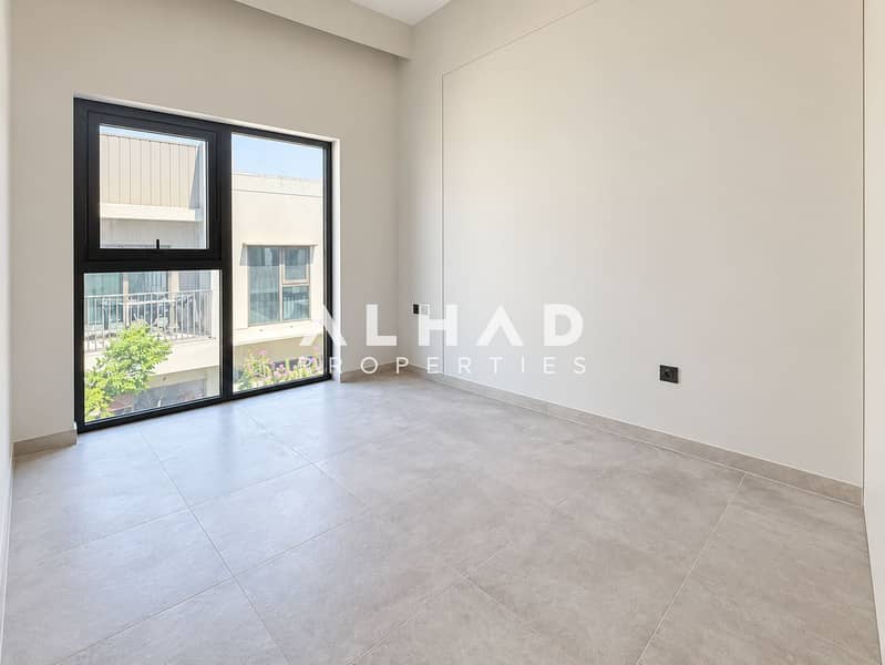 2 Modern Empty Room with Charcoal-Framed Window. png