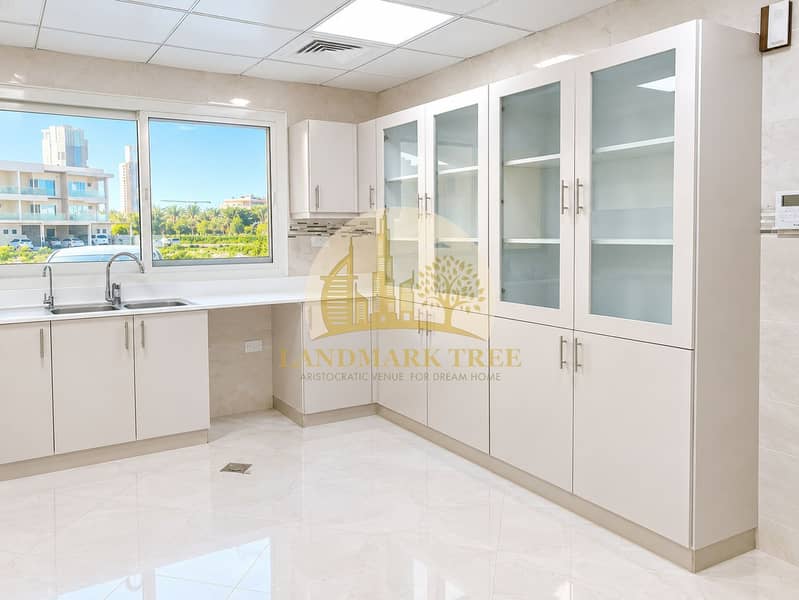 4 Bright Modern Kitchen with Glass Cabinetry. png