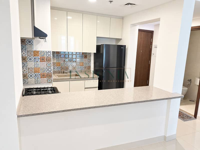 4 Modern Mosaic-Tile Kitchen and Breakfast Bar. png