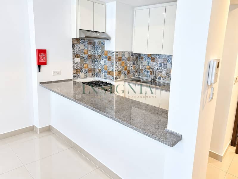 6 Bright Minimalist Kitchen with Mosaic Backsplash. png