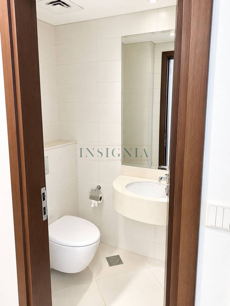 7 Modern Minimalist Bathroom Through Doorway. png