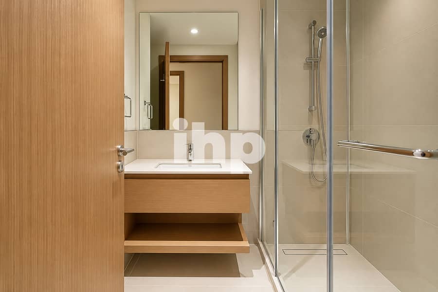 13 wide_angle_well_lit_modern_bathroom_interior_shot. jpg