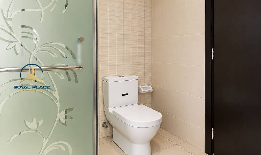 11 Modern Beige Tiled Bathroom with Frosted Glass. png