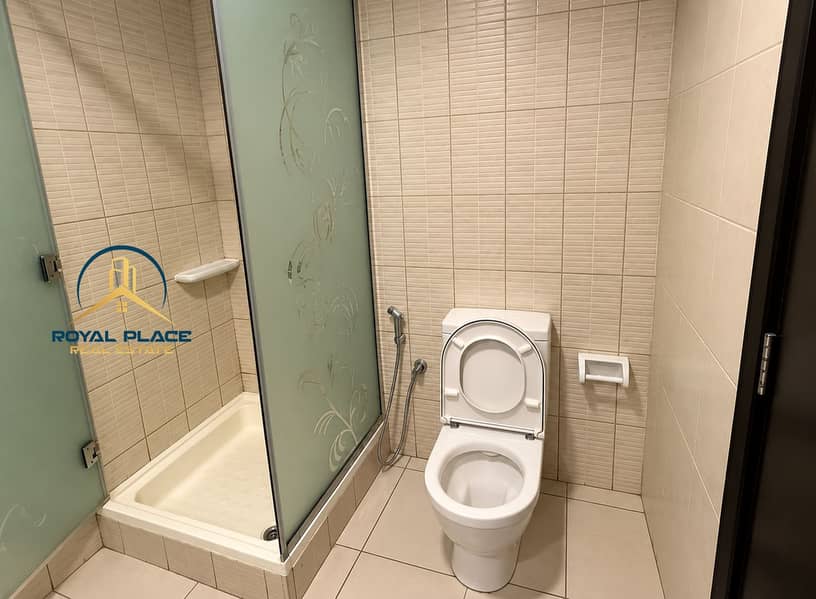 13 Modern Beige Bathroom with Frosted Shower. png