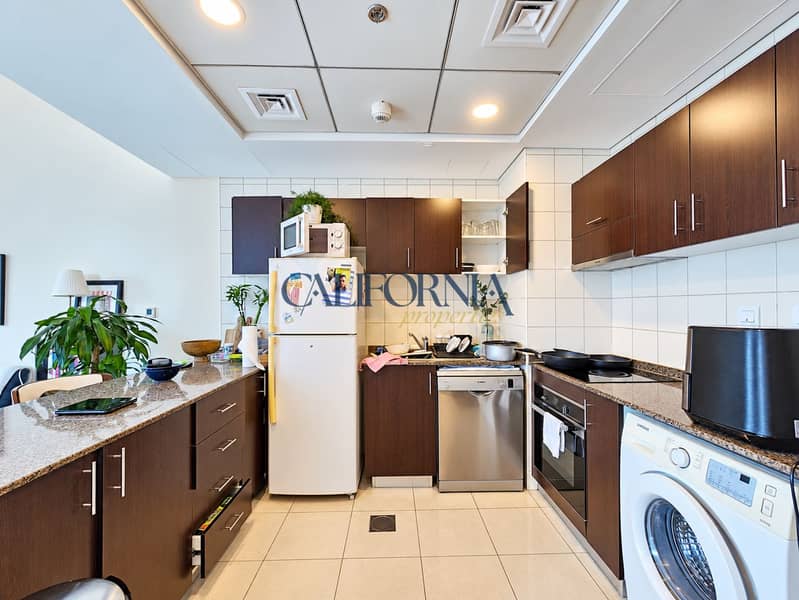 6 Bright kitchen with open cabinets. png
