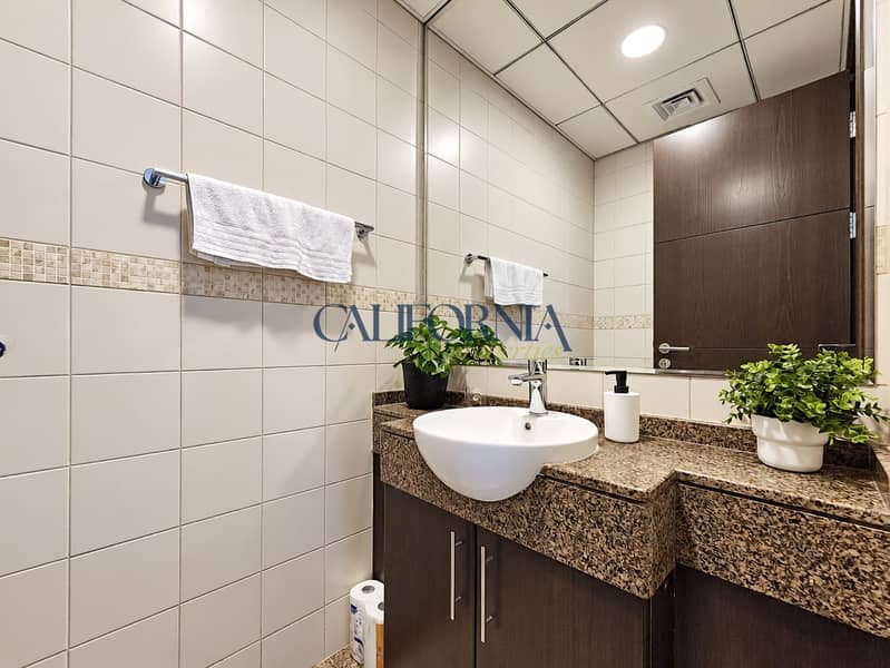 8 Refined Bathroom Vanity With Mirror And Plants. png