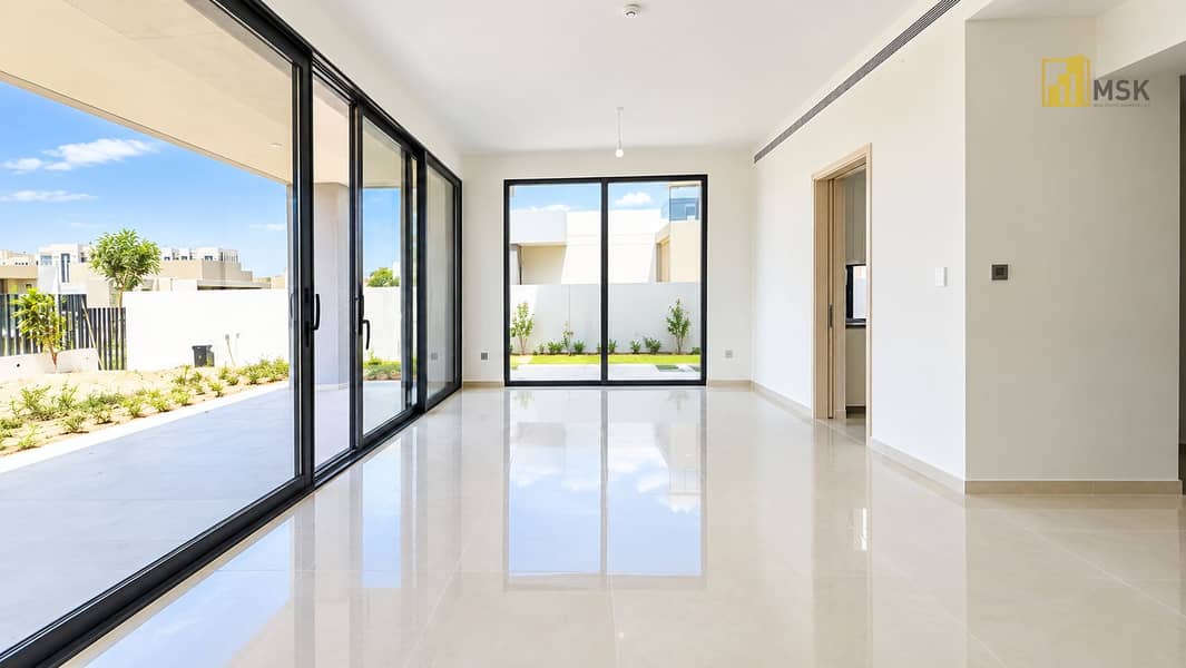 5 Sunlit Minimalist Glass-Walled Interior. png