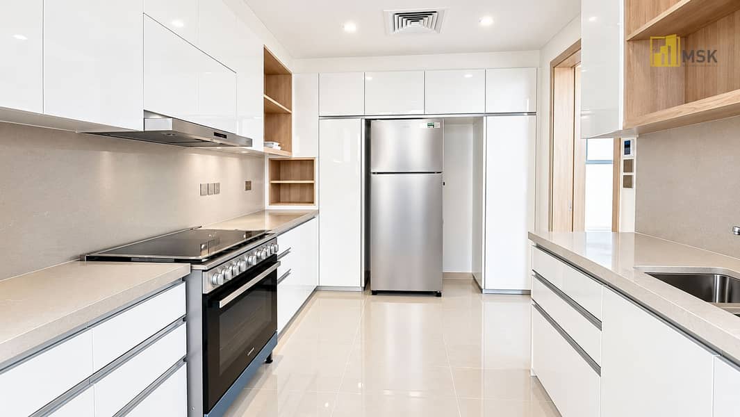 7 Minimalist Galley Kitchen in White and Wood. png