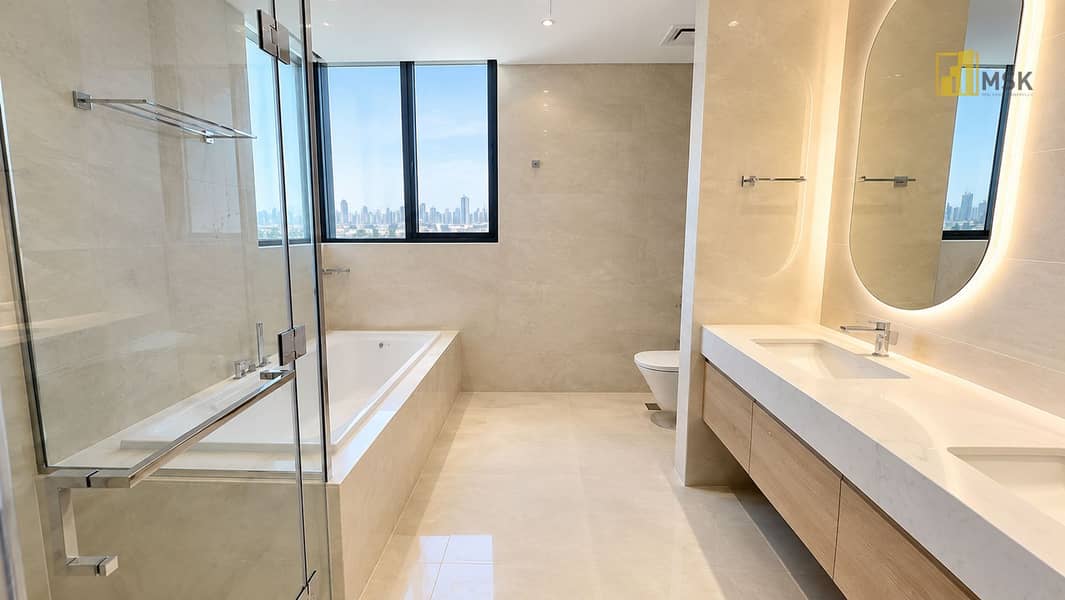 12 Luxurious Marble Bathroom with City Views. png