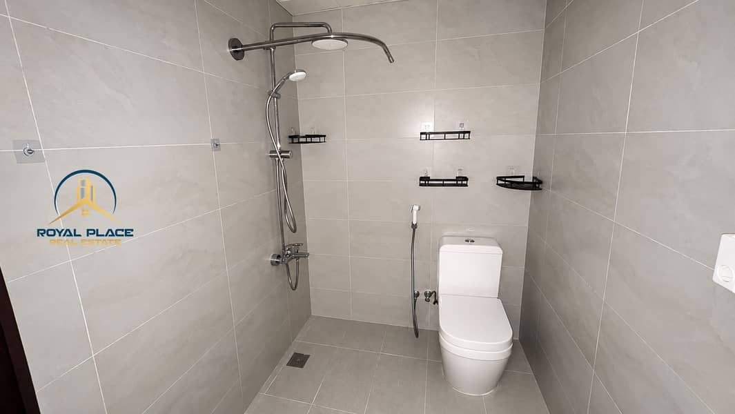 8 Modern Minimalist Tiled Bathroom with Shower and Toilet. png