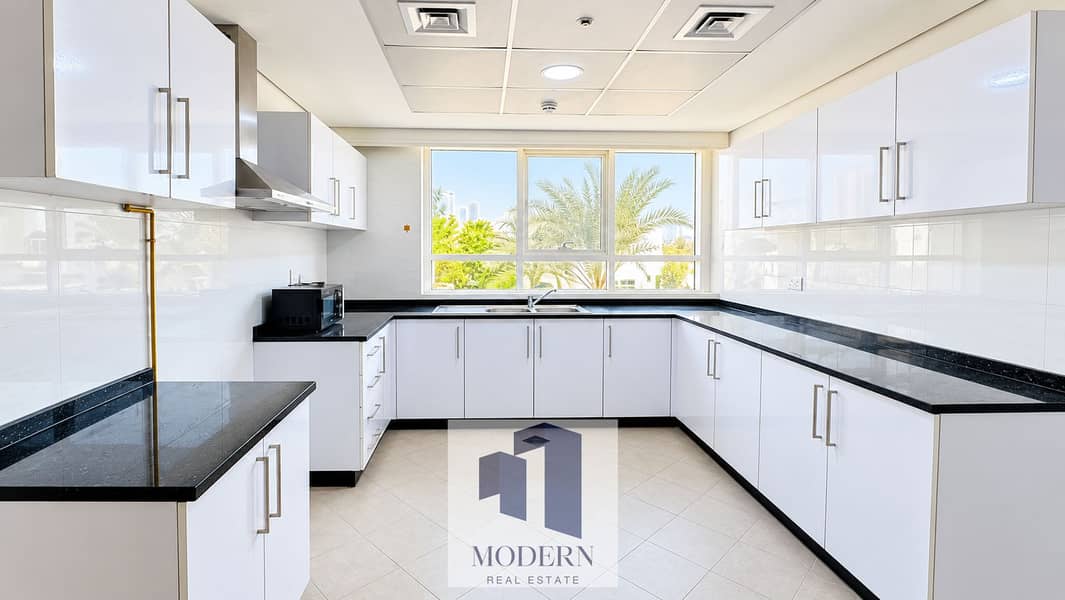5 Bright Modern Kitchen with Tropical View. png