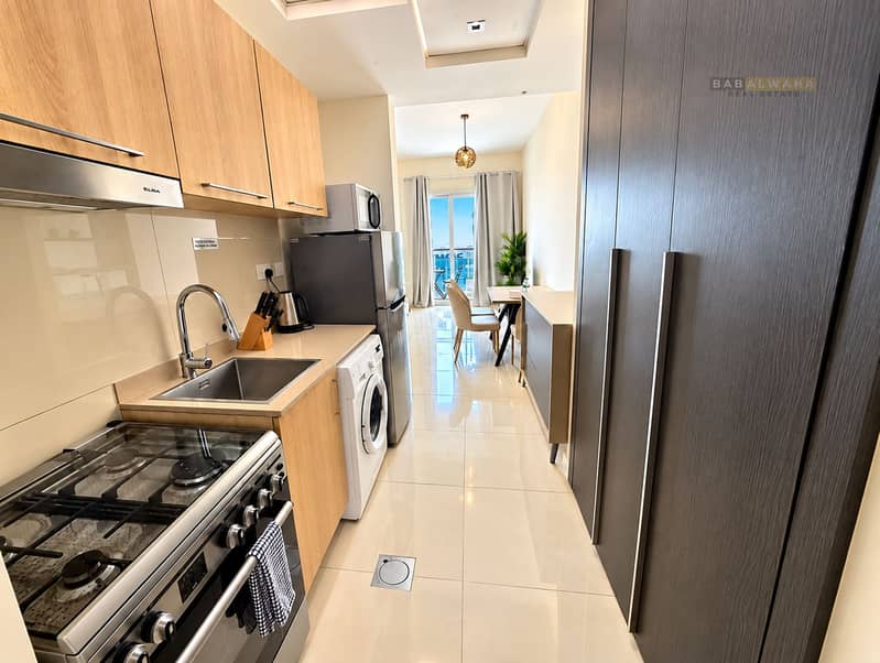 6 Modern Galley Kitchen with Balcony View. png