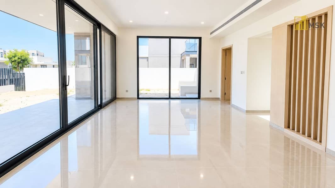 4 Bright Minimalist Living Space with Patio Views. png