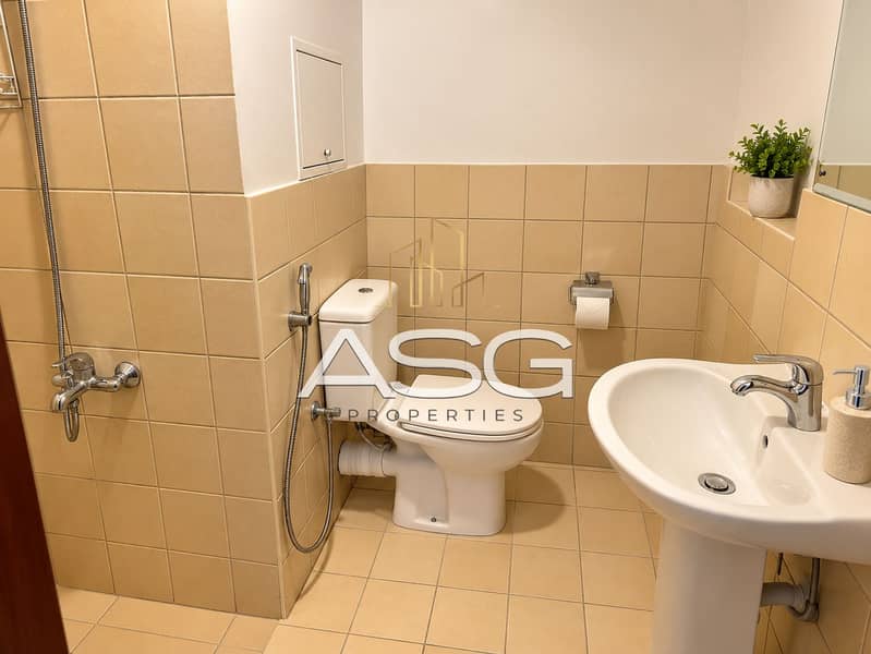 17 Warm Minimalist Beige-Tiled Bathroom. png