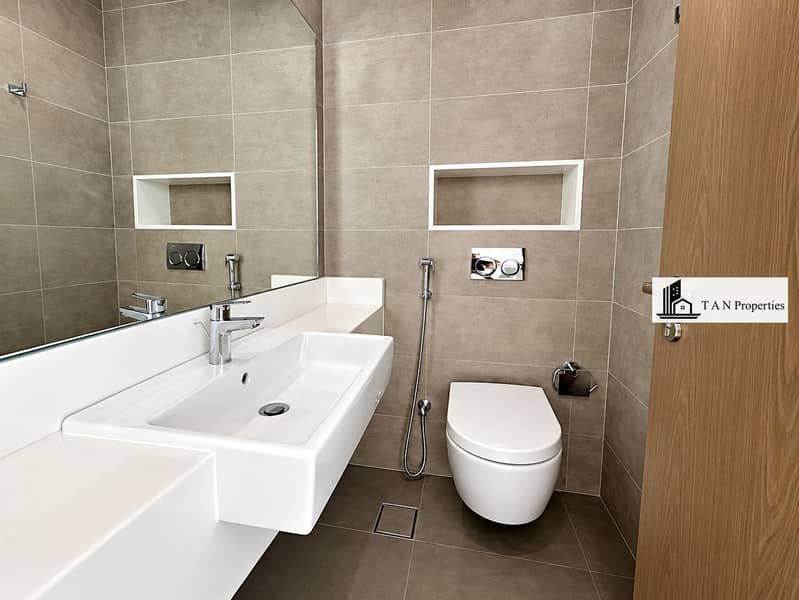 10 Minimalist Grey-Tile Bathroom with Floating Sink. png