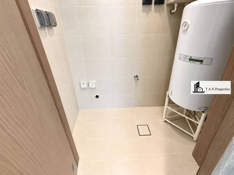 11 Modern Tiled Utility Room with Water Heater. png