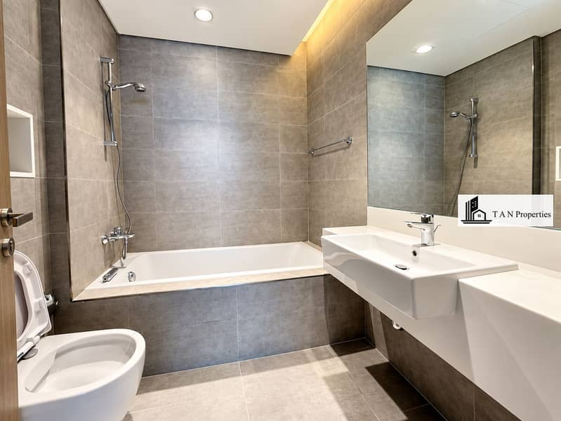 14 Modern Gray-Tiled Bathroom with Freestanding Vanity. png