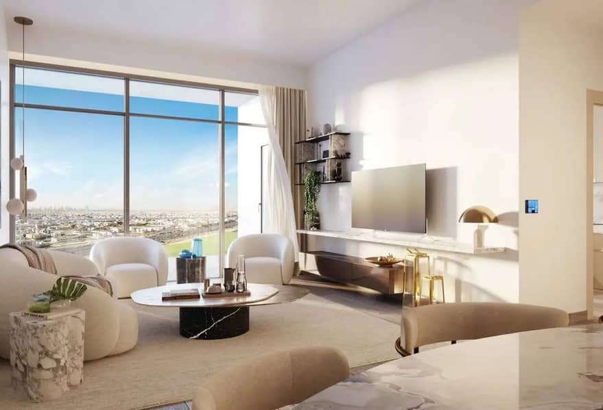 2 Bright living room with cream sofas, round coffee table, and floor-to-ceiling windows opening to a city view.