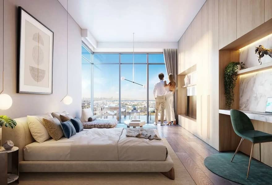 4 Furnished bedroom with a beige bed, floor-to-ceiling windows, and a couple looking out at the city skyline.