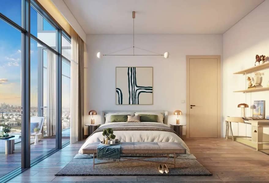 5 Bedroom with a double bed, green cushions, and floor-to-ceiling windows opening to a balcony and city view.