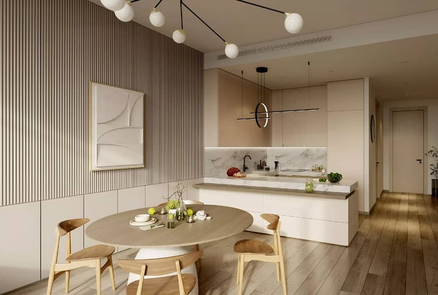 6 Modern kitchen with a marble-topped island, a round dining table, and pendant lighting.