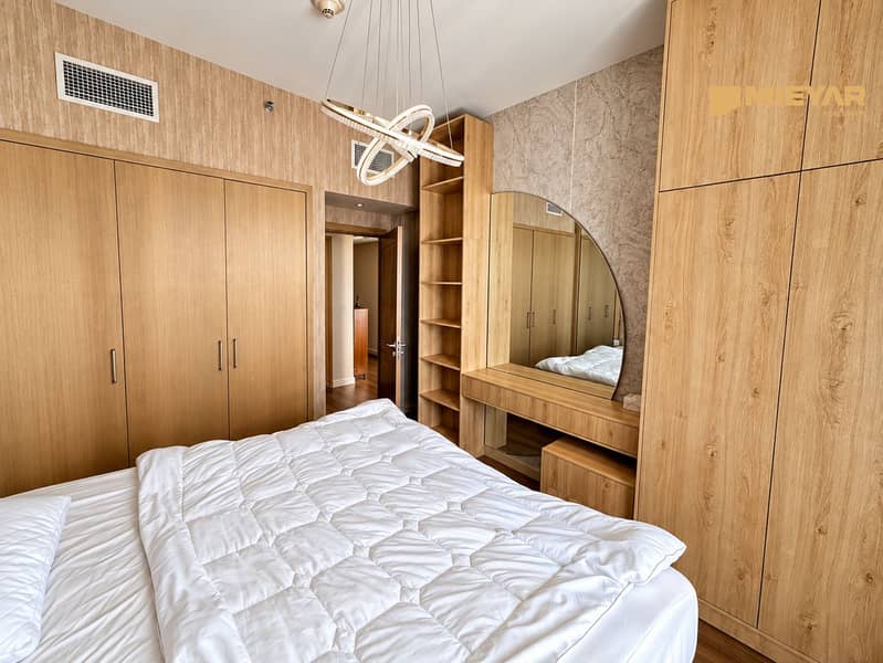 7 Warm Modern Bedroom with Sculptural Chandelier. png