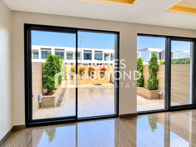 2 Modern Room Opening to a Lush Courtyard. png