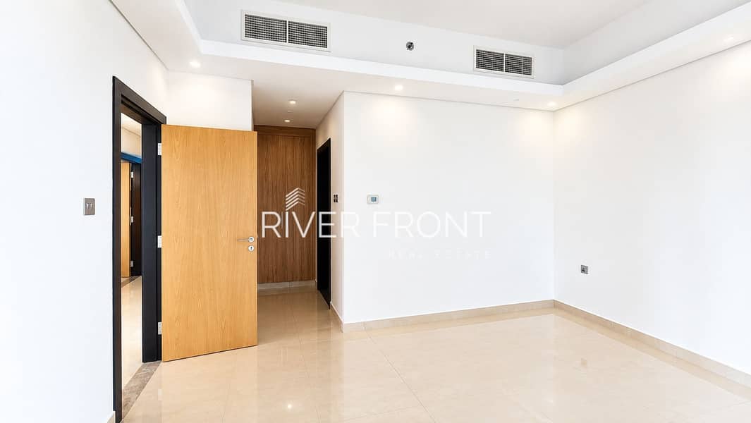 2 Bright Minimalist Interior with Open Wooden Door (1). jpg