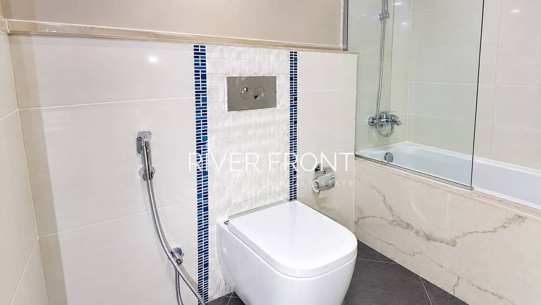 8 Modern Beige Bathroom with Blue Mosaic Accents. jpg