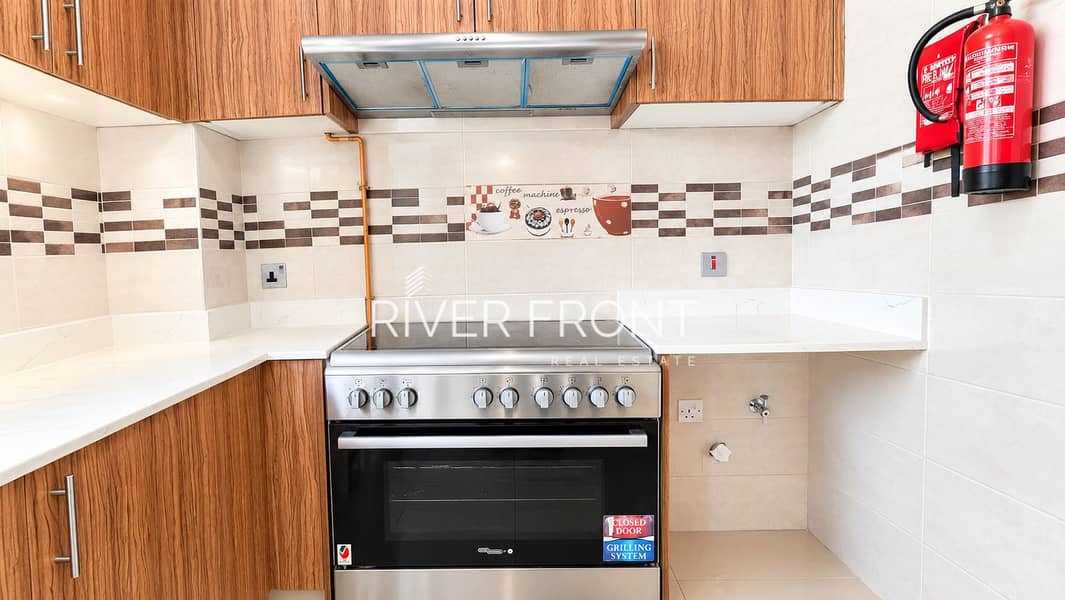 5 Bright Modern Kitchen with Coffee-Themed Backsplash. jpg