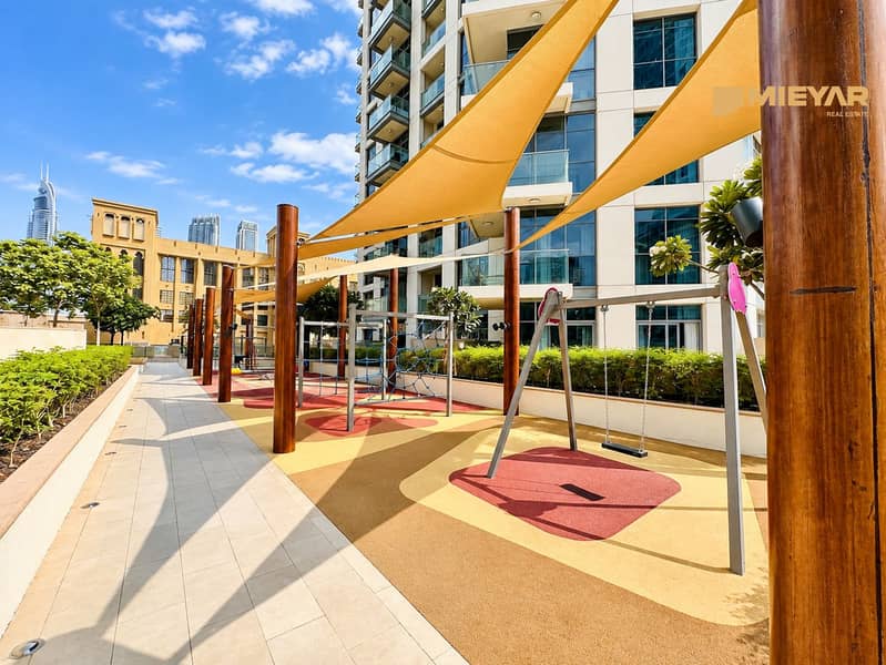 13 Sunny Urban Playground with Geometric Shade Sails. png