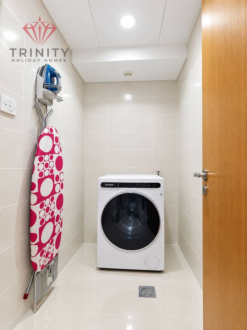 6 Minimalist Laundry Room with Pink Ironing Board. png