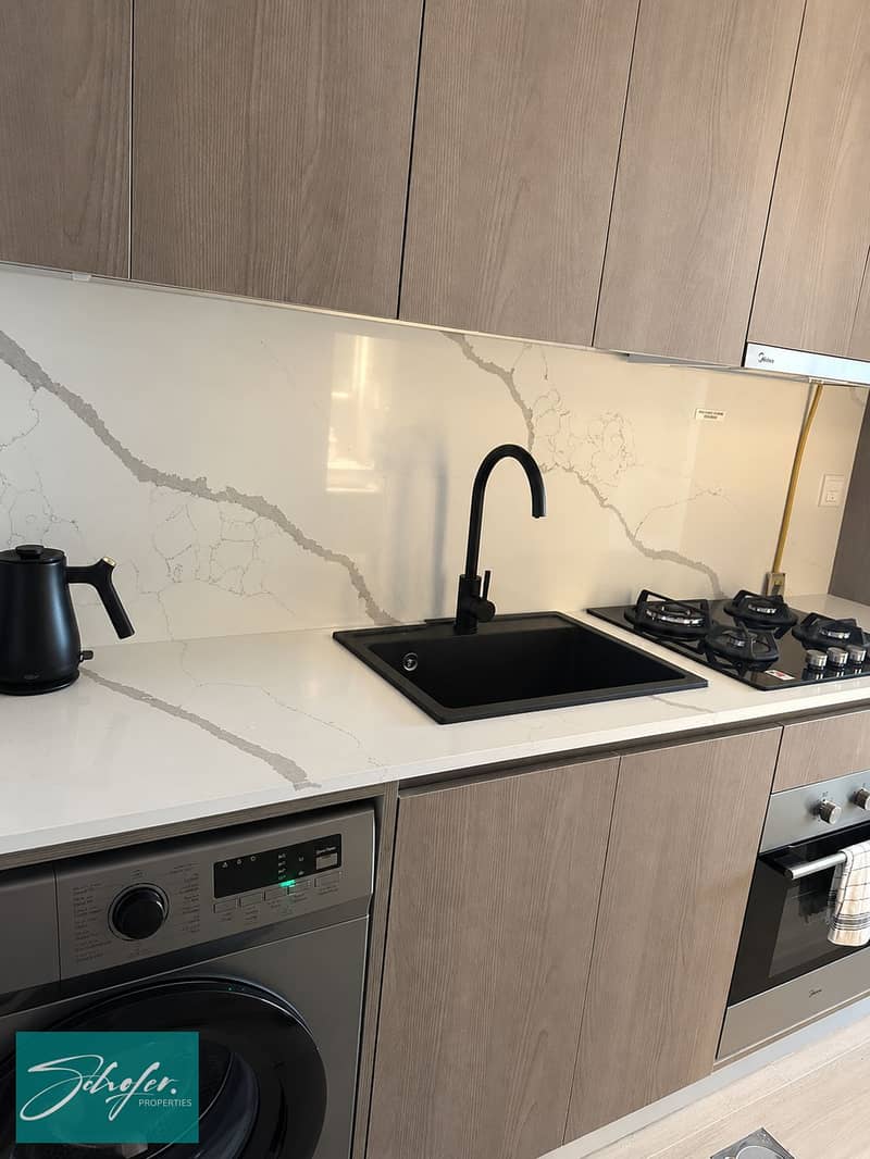 5 Minimalist Marble Kitchen with Black Accents. png