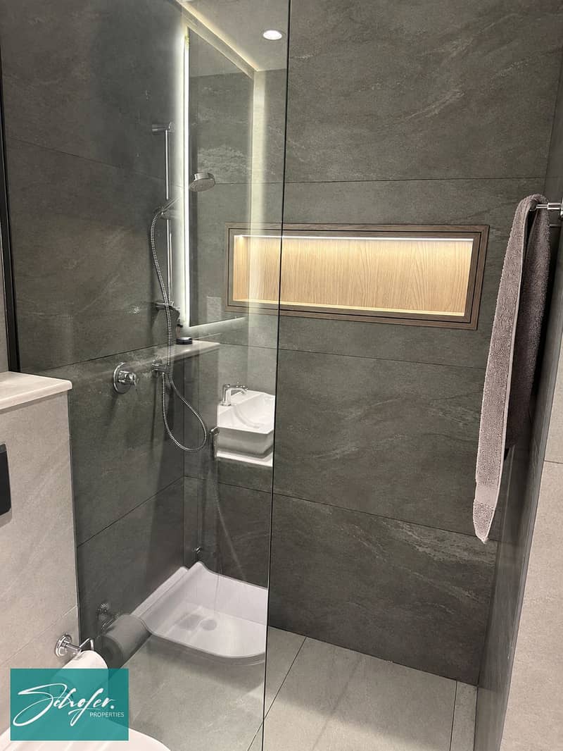 8 Minimalist Dark Stone Walk-In Shower (1). png