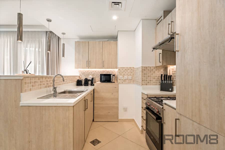 10 Warm Minimalist Galley Kitchen. png