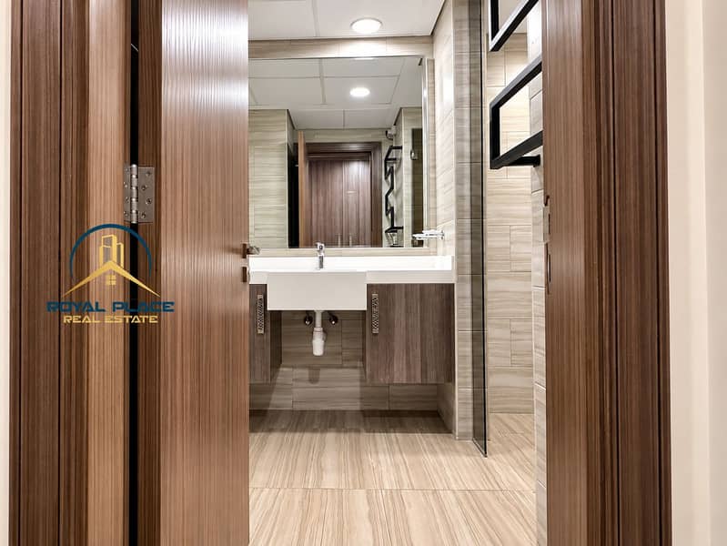15 Symmetrical Modern Bathroom Through Wooden Door. png