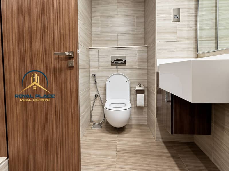 17 Modern Minimalist Bathroom with Warm Wood Accents. png
