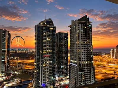 1 Bedroom Apartment for Rent in Jumeirah Lake Towers (JLT), Dubai - Metropolitan Sunset Skyline with Highway Lights. png