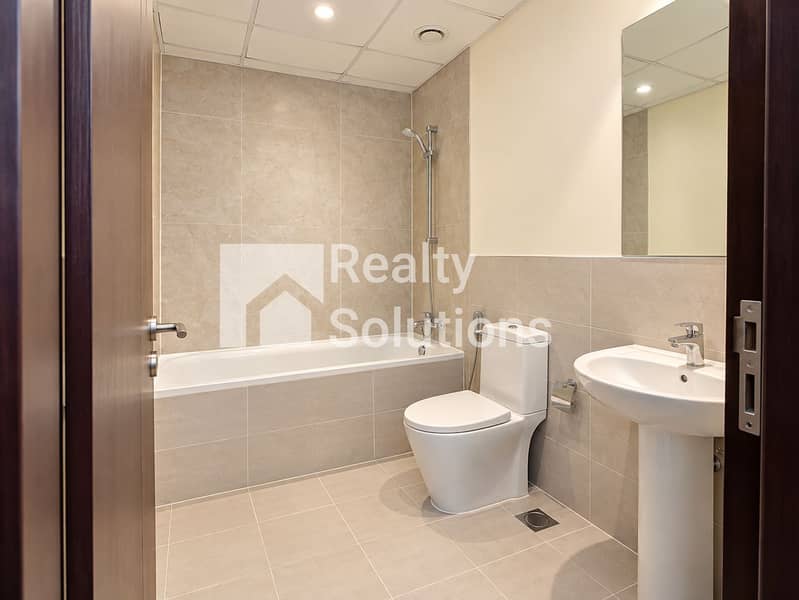 4 Modern Neutral Tiled Bathroom. png