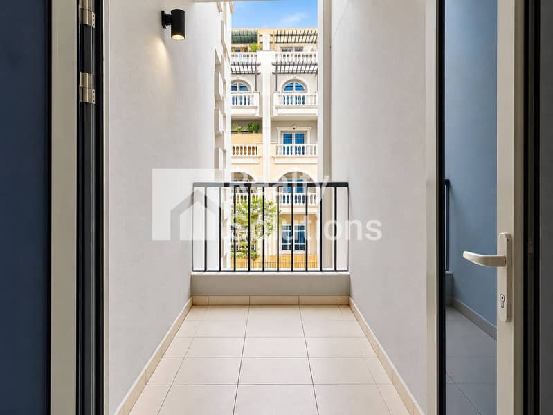 9 Sunlit Balcony View Framed by Open Doors. png