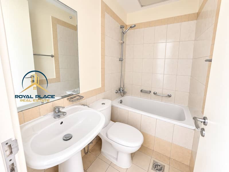11 Bright Modern Beige-Tiled Bathroom. png