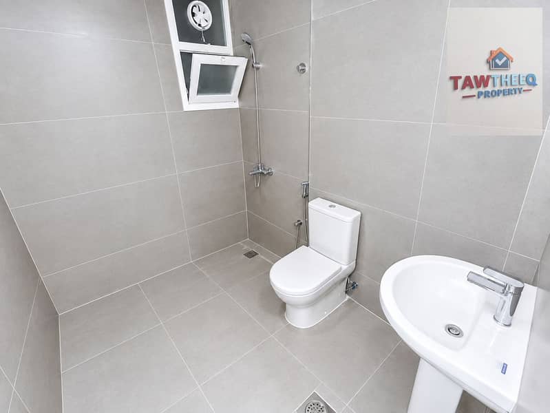 12 Modern Minimalist Gray-Tiled Bathroom. png