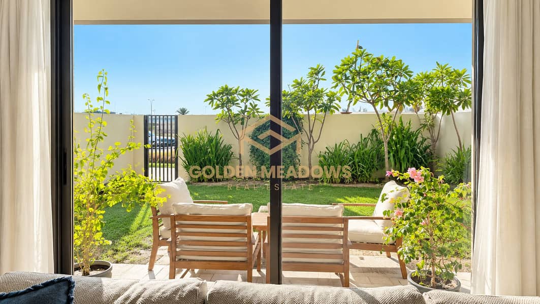 Sunlit Patio Garden Through Glass Doors. png Sunlit Patio Garden Through Glass Doors. png