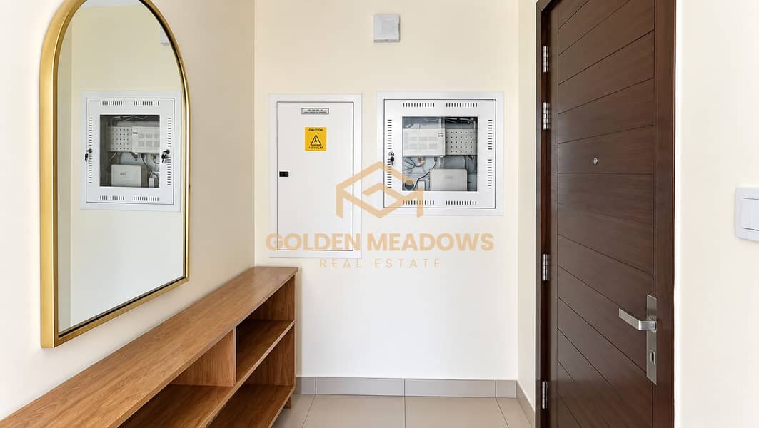 2 Modern Entryway with Arched Mirror and Utility Panels. png