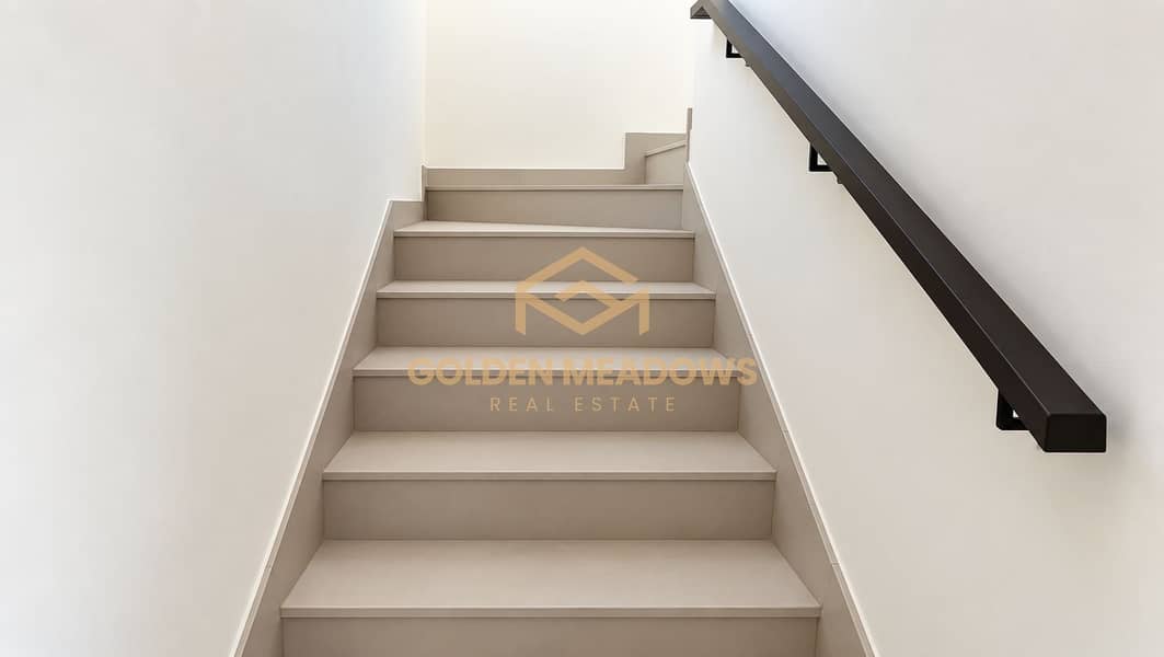 6 Minimalist Beige Staircase with Dark Handrail. png